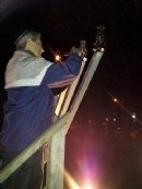Chanukah on the Franklin Town Common: Andy David, lighting a Candle