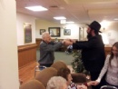 Chanukah: Smile on Seniors!: Rabbi Mendy doing the Chassidic dance...
